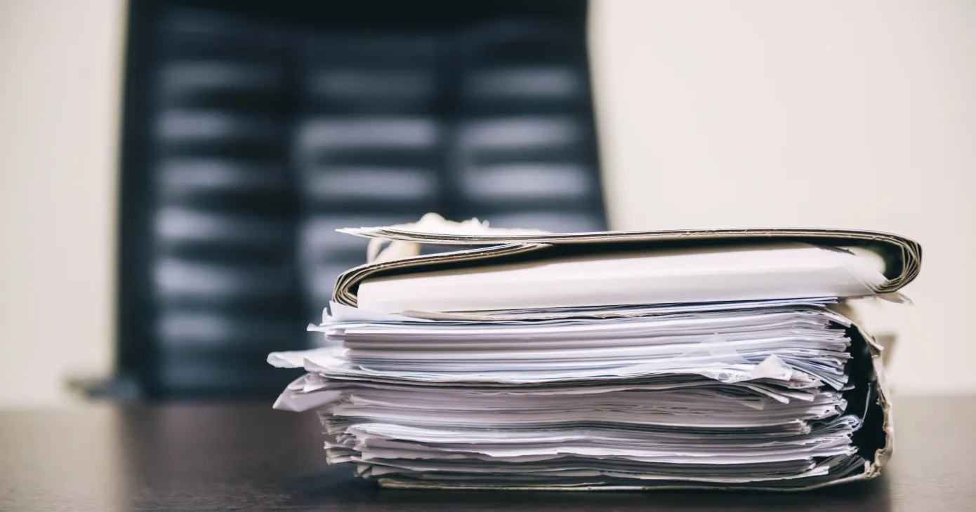 Pile of unfinished documents on office desk, Stack of business paper. A file folders with documents and important documents.